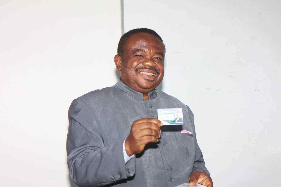 Chairman of COSON, Chief Tony Okoroji displaying his NEIHIS identity card after the official presentation