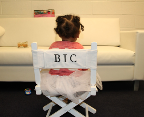 Blue Ivy Carter sitting in a chair