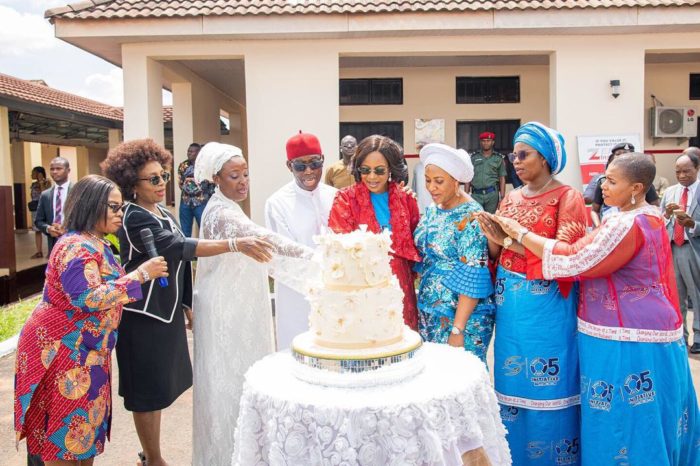 Gov. Okowa flanked on the right by wife Dame Edith Okowa while cutting her birthday cake