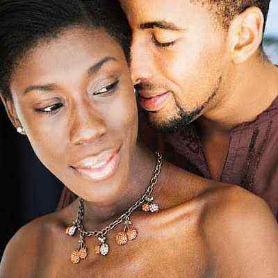 African couple hugging