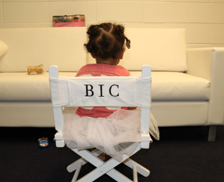 Blue Ivy Carter sitting in a chair
